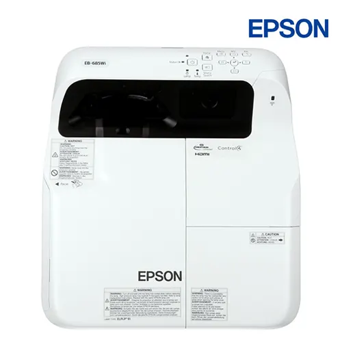 Thấu kính lồi tỷ lệ ném cực ngắn và cảm biến tương tác Epson EB-685Wi Mặt trên máy chiếu Epson EB-685Wi trang bị cụm thấu kính lồi đặc trưng của dòng Ultra Short Throw giúp phóng hình lớn ở khoảng cách chỉ vài centimet.